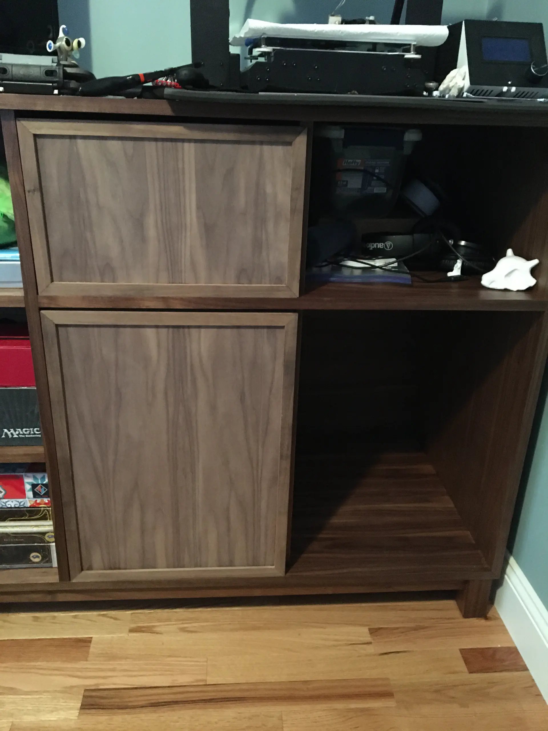The walnut doors in place but not mounted on the cabinet or drawers